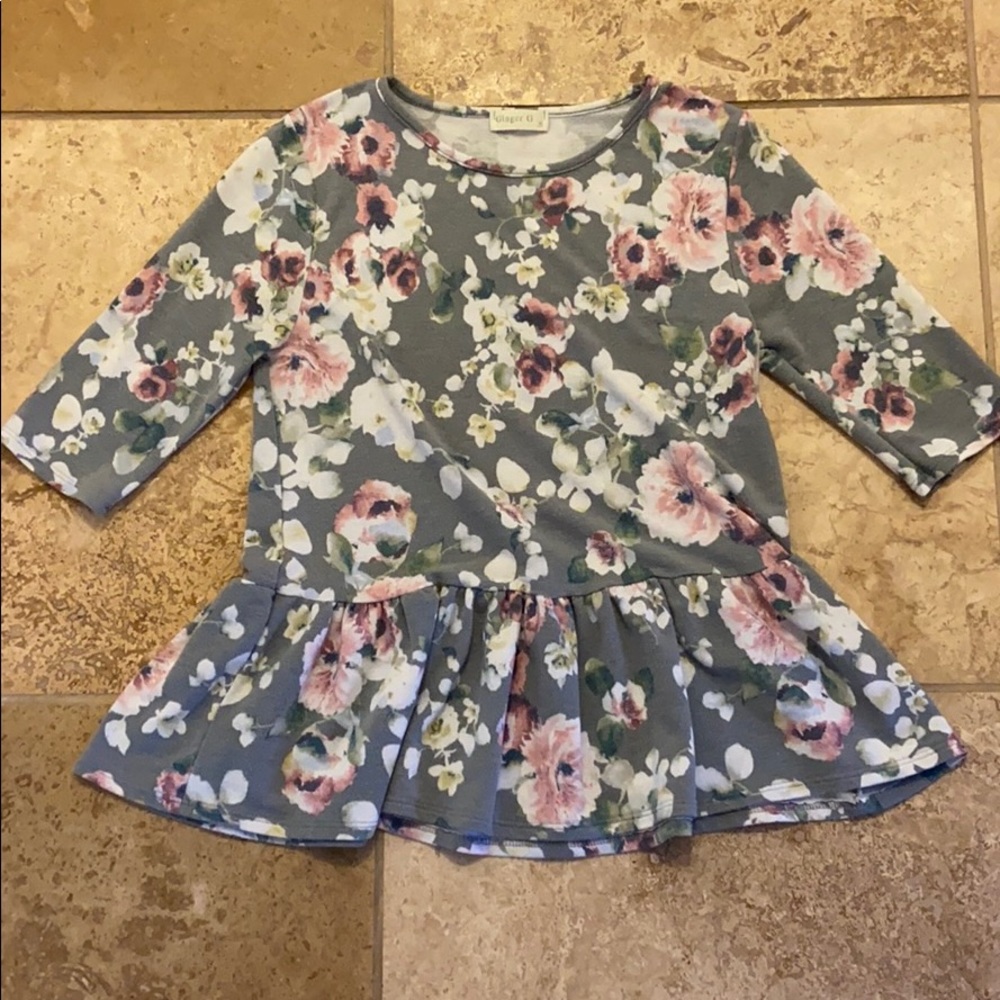 Floral half sleeve blouse.